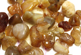 Honey agate tumbles