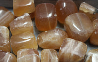 Honey calcite tumbles