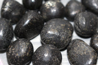 Nuummite tumbles
