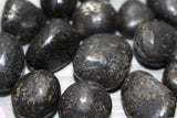 Nuummite tumbles