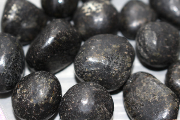 Nuummite tumbles