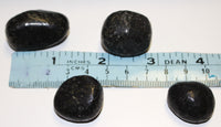 Nuummite tumbles