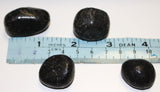 Nuummite tumbles