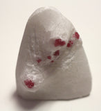 Red spinel on marble