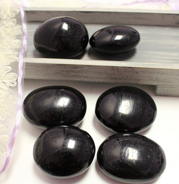 Black tourmaline palmstone polished