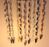 beautiful pendulums can help you to get answers and can be worn as a bracelet.   Choice of Amethyst, Carnelian, Golden Quartz, Garnet, Labradorite, Blue Aventurine, Black Tourmaline, Crystal Quartz, Rose Quartz, & Tiger Eye.   Each have 6-8 clusters of gemstone chips and corresponding polished pointed gemstone. Average length-9-10 inches or 23-26 cm. 22.00 dollars per piece 