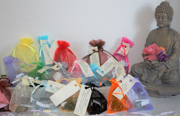 Mojo Bags. 17 different varieties available. Success, clarity, strength, family, courage, happiness, connection, grounding, fun, prosperity, love, protection, truth, sorrow, sleep, abundance and angels.   Each bag contains 3-4 crystals with an information card  a charm  and an affirmation. $12.00 