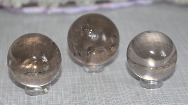 smokey quartz spheres approximately 1 inch or 2.5cm in diameter. $50.00 per piece 