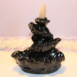 This waterfall incense holder is 4.75 inches or 12 cm in height. The length is 5.25 inches or 13.5 cm. $15.00.
