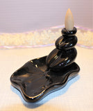 The waterlily back flow incense holder is 2.5 in or 6.5cm in height and 5 inches or 13cm in length. $15.00
