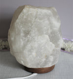 7 inch white Himalayan salt lamp, comes with cord and light bulb-$40.00 per piece